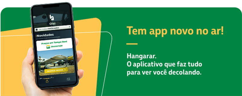 Uma parceria BR Aviation e Hangarar para o mercado de aviação. Na imagem, mão segura smartphone com o aplicativo na tela. No lado direito, o texto: Vem aí o aplicativo que faz tudo para você decolar! Uma parceria BR Aviation e Hangarar para o mercado de aviação.